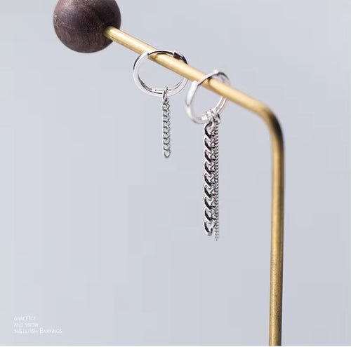 pendientes colgantes redondos con borla