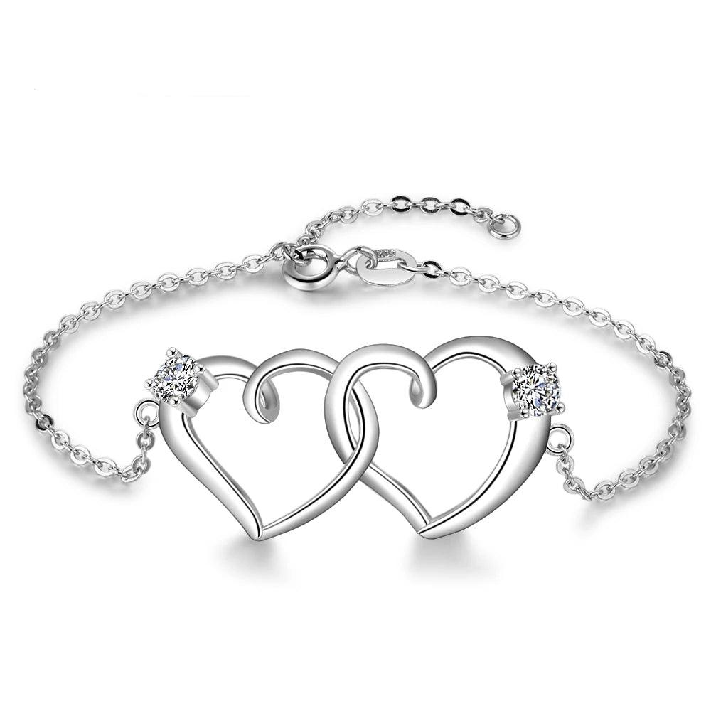 Pulsera de corazón entrelazado de Color plateado con circonita cúbica para mujer