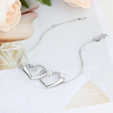 Load image into Gallery viewer, Pulsera de corazón entrelazado de Color plateado con circonita cúbica para mujer